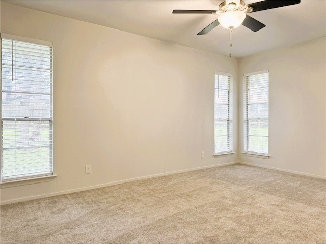 12104 Sage Hen Cir, Austin, TX 78727 - carpeted spare room featuring baseboards and a ceiling fan