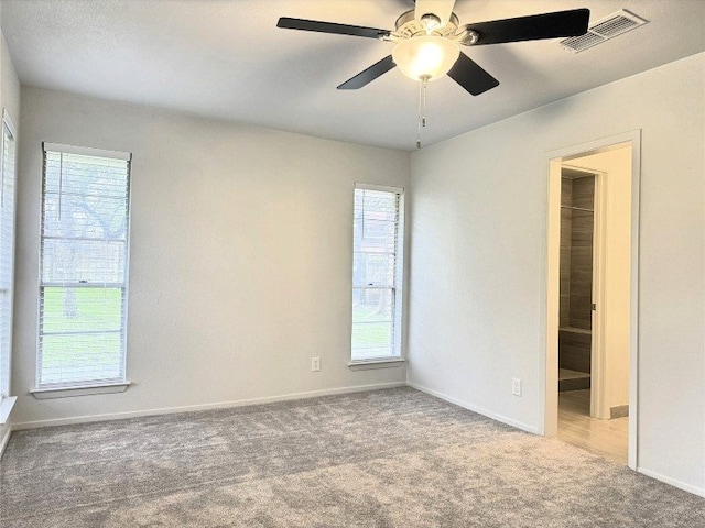 12104 Sage Hen Cir, Austin, TX 78727 - carpeted spare room featuring baseboards and a ceiling fan