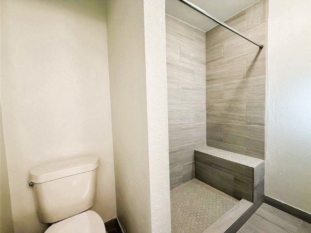 12104 Sage Hen Cir, Austin, TX 78727 - bathroom featuring tiled shower and toilet