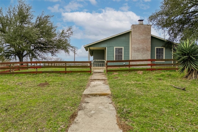 view of front of home with a front lawn