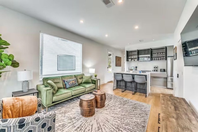 111 Little Walnut Dr Unit 1, Austin, TX 78753 - living area featuring light wood-style floors and recessed lighting