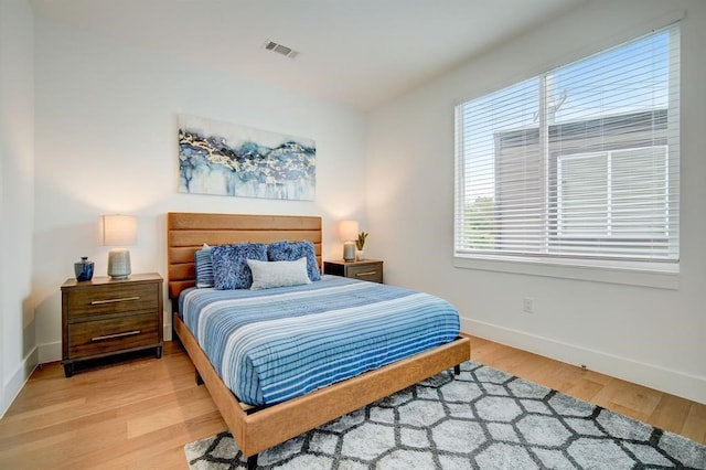 111 Little Walnut Dr Unit 1, Austin, TX 78753 - bedroom featuring baseboards and light wood finished floors