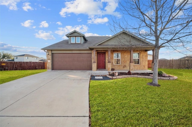 view of front of house featuring a garage and a front yard