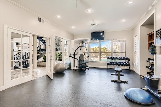 workout area with crown molding and french doors