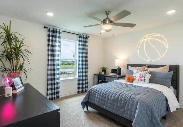 bedroom with ceiling fan and carpet flooring