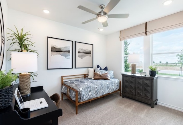 carpeted bedroom with ceiling fan