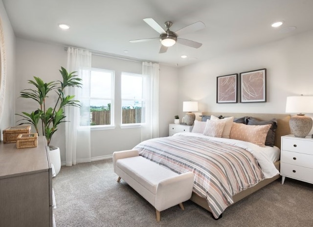 bedroom with ceiling fan and carpet flooring