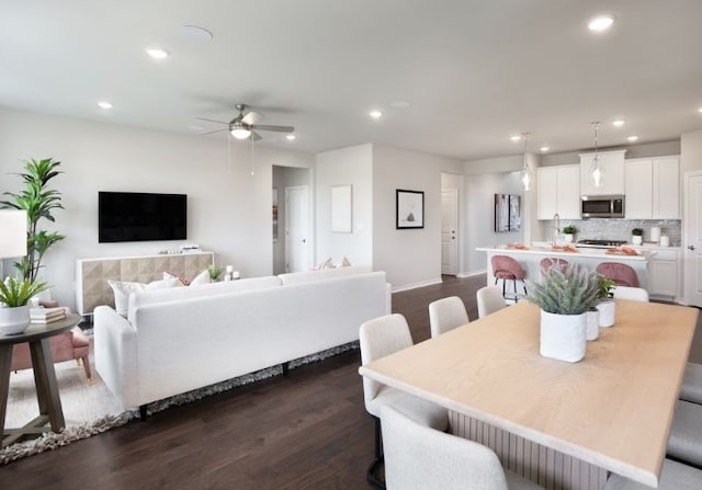 dining room featuring dark hardwood / wood-style floors and ceiling fan