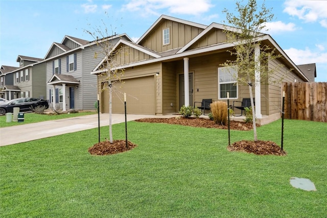 view of front of property with a garage and a front yard