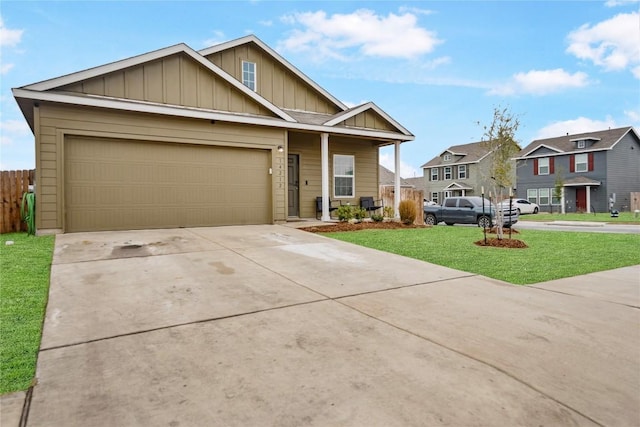 view of front of property with a garage and a front yard