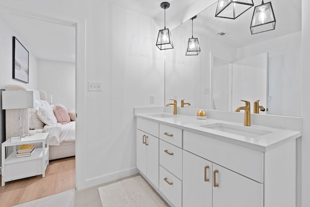 bathroom featuring hardwood / wood-style flooring and vanity