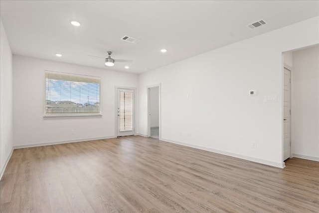 unfurnished room featuring ceiling fan and light hardwood / wood-style floors