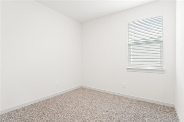 spare room with carpet