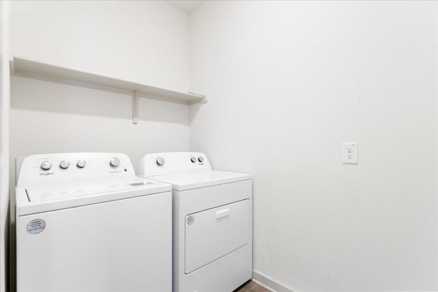 laundry room featuring washing machine and clothes dryer