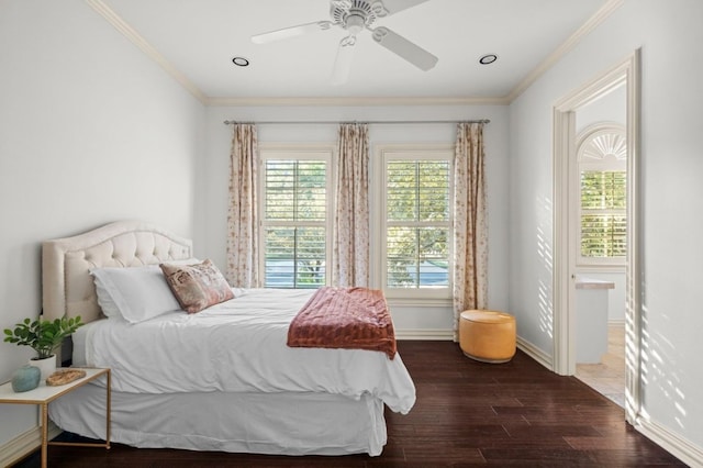 bedroom featuring dark hardwood / wood-style floors, ceiling fan, and ornamental molding