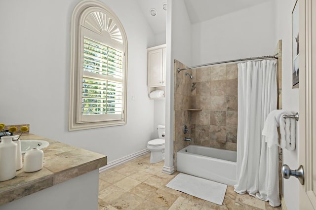 full bathroom featuring shower / bath combo, vanity, and toilet