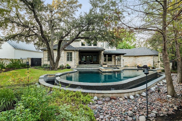 view of swimming pool with a patio area and an in ground hot tub