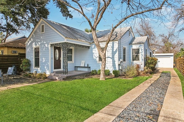 bungalow-style home featuring a front yard