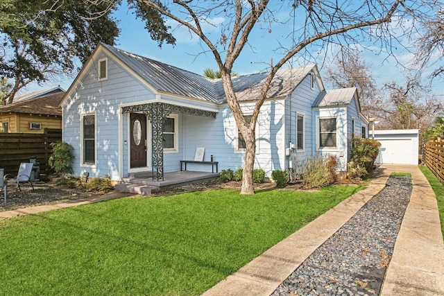 906 E 43rd St, Austin, TX 78751 - bungalow-style home with covered porch, a metal roof, driveway, and a detached garage