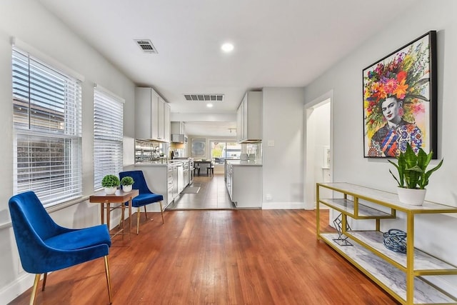 906 E 43rd St, Austin, TX 78751 - sitting room featuring dark wood-style floors and recessed lighting
