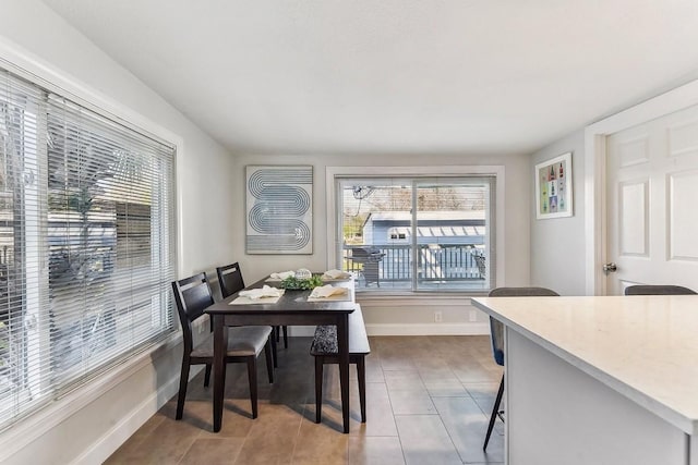 906 E 43rd St, Austin, TX 78751 - dining space with healthy amount of natural light and dark tile patterned flooring