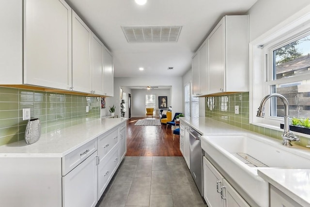 906 E 43rd St, Austin, TX 78751 - kitchen with recessed lighting, white cabinets, tile patterned floors, ceiling fan, and tasteful backsplash