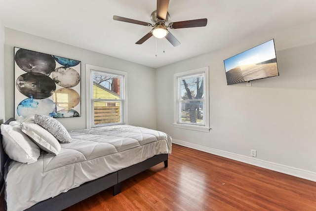 906 E 43rd St, Austin, TX 78751 - bedroom featuring wood finished floors and a ceiling fan