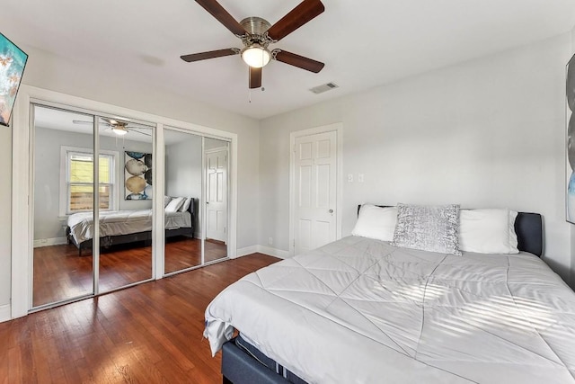 906 E 43rd St, Austin, TX 78751 - bedroom featuring two closets, wood finished floors, and ceiling fan