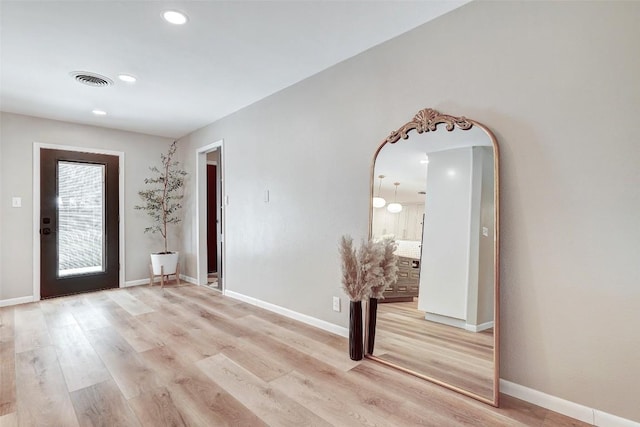 entrance foyer with light hardwood / wood-style flooring