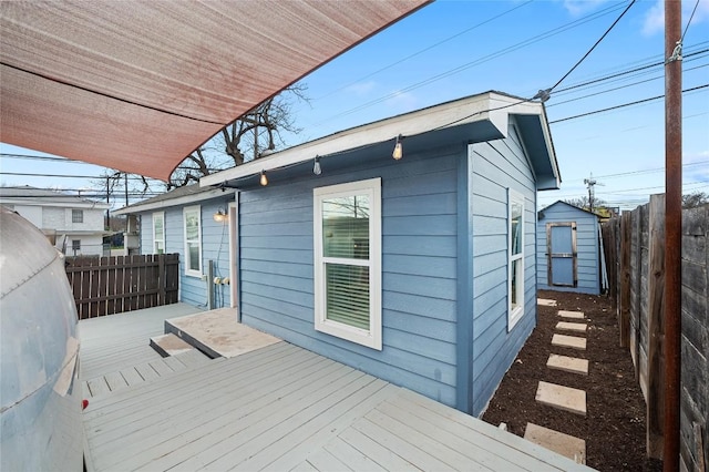 1191 Chicon St, Austin, TX 78702 - wooden deck featuring a fenced backyard and a shed