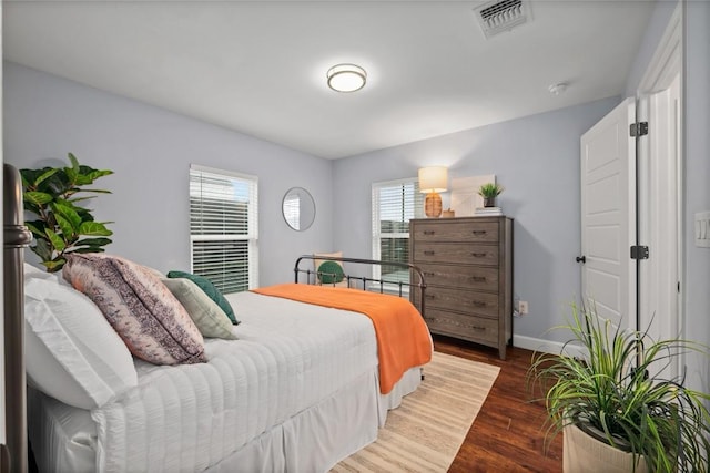 bedroom featuring dark hardwood / wood-style flooring