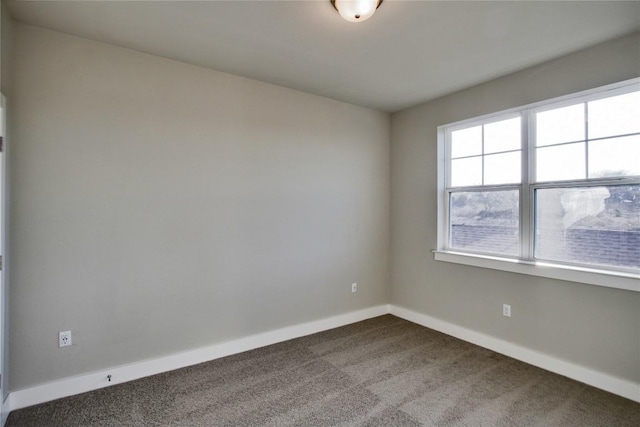 5812 Rotunda Vw, Austin, TX 78747 - empty room with dark colored carpet and baseboards