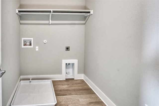 5812 Rotunda Vw, Austin, TX 78747 - laundry area with hookup for a gas dryer, hookup for an electric dryer, washer hookup, wood finished floors, and baseboards