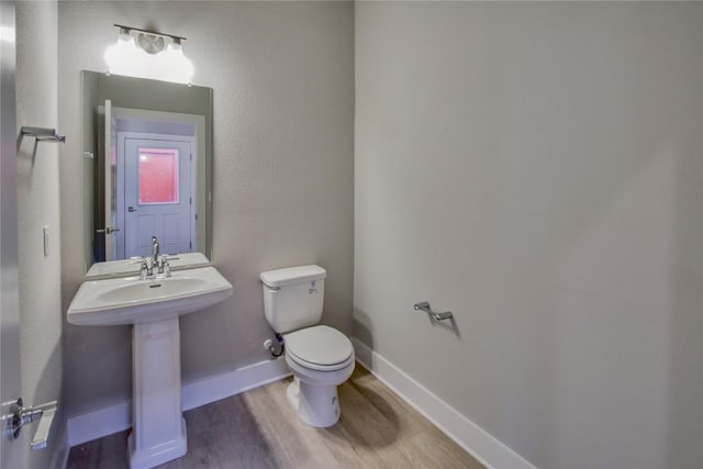 5812 Rotunda Vw, Austin, TX 78747 - bathroom featuring toilet and wood finished floors