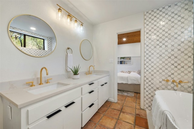 bathroom with vanity and a bathing tub