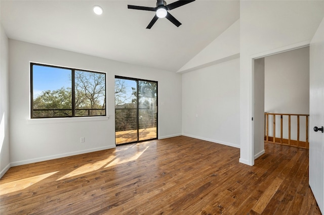 unfurnished room featuring dark wood-type flooring, high vaulted ceiling, and ceiling fan