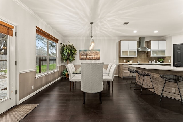 3305 Avenal Dr, Austin, TX 78738 - dining space featuring dark wood-style flooring, recessed lighting, and ornamental molding