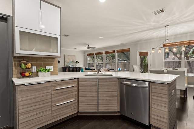 3305 Avenal Dr, Austin, TX 78738 - kitchen with stainless steel dishwasher, modern cabinets, light countertops, crown molding, and recessed lighting