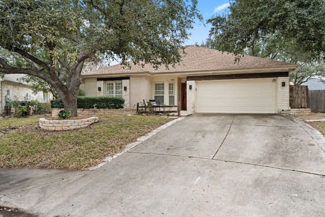 3305 Avenal Dr, Austin, TX 78738 - single story home with brick siding, a garage, and concrete driveway
