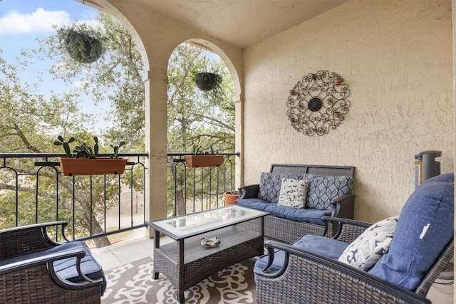 exterior space with an outdoor living space and a balcony