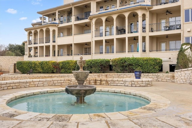 view of swimming pool featuring ceiling fan