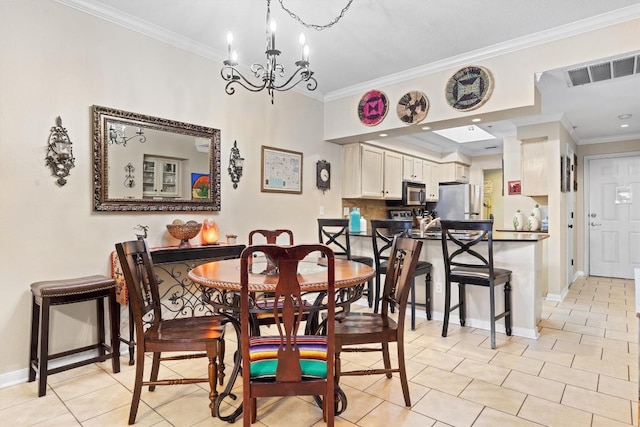 dining space featuring baseboards, ornamental molding, visible vents, and an inviting chandelier