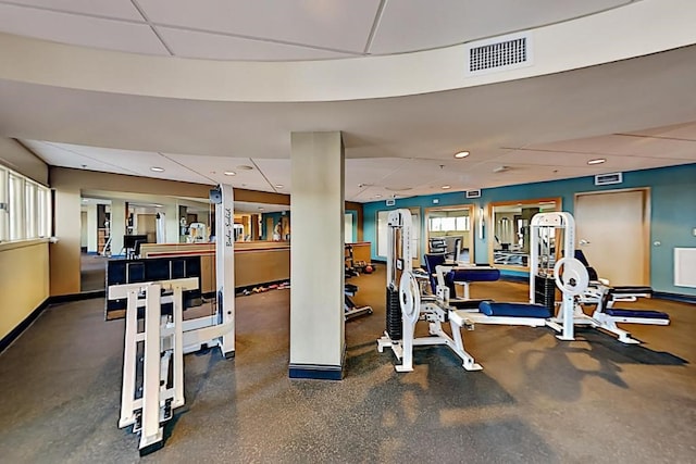 exercise room featuring recessed lighting, baseboards, visible vents, and a drop ceiling