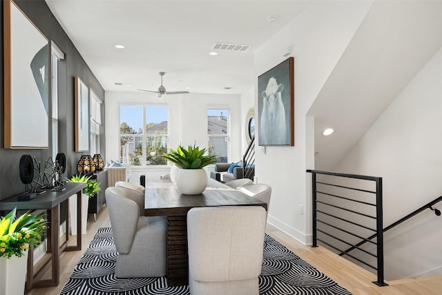 dining area featuring ceiling fan and light hardwood / wood-style floors