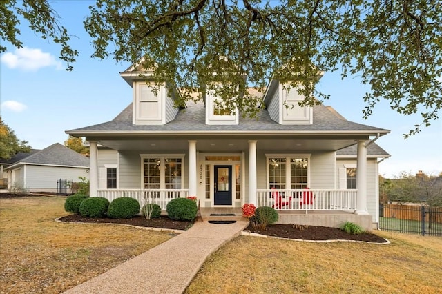 view of front of home featuring a porch and a front yard