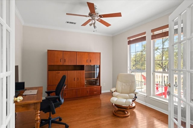 office area featuring light hardwood / wood-style flooring, ornamental molding, and ceiling fan