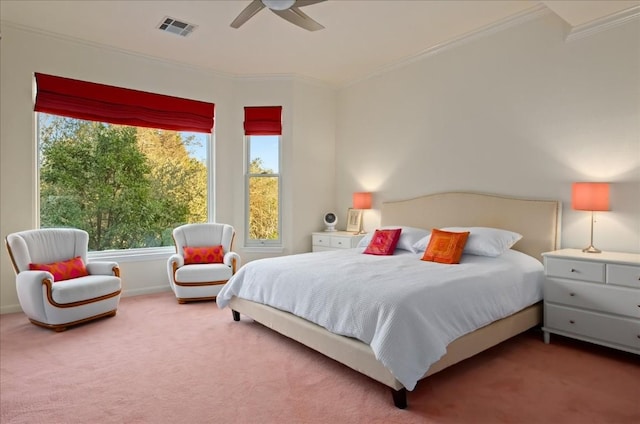 carpeted bedroom with ceiling fan and ornamental molding