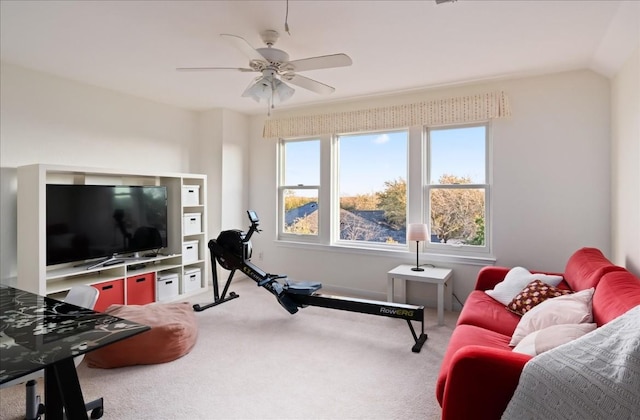 workout area with lofted ceiling, carpet floors, and ceiling fan