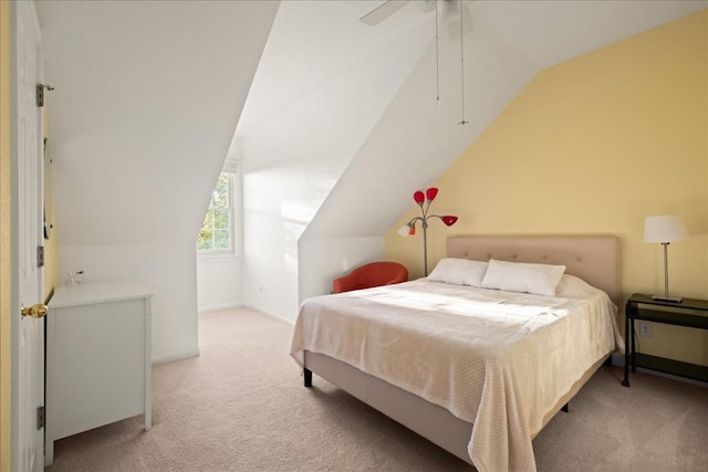 carpeted bedroom with lofted ceiling and ceiling fan