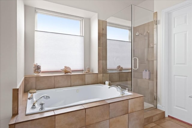 bathroom with tile patterned floors, plenty of natural light, and separate shower and tub